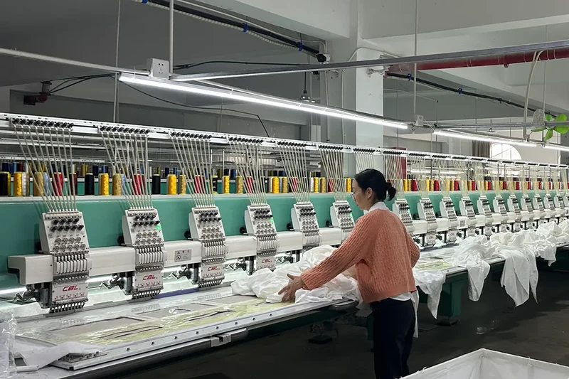 Multi-head embroidery machines producing custom branded towels
