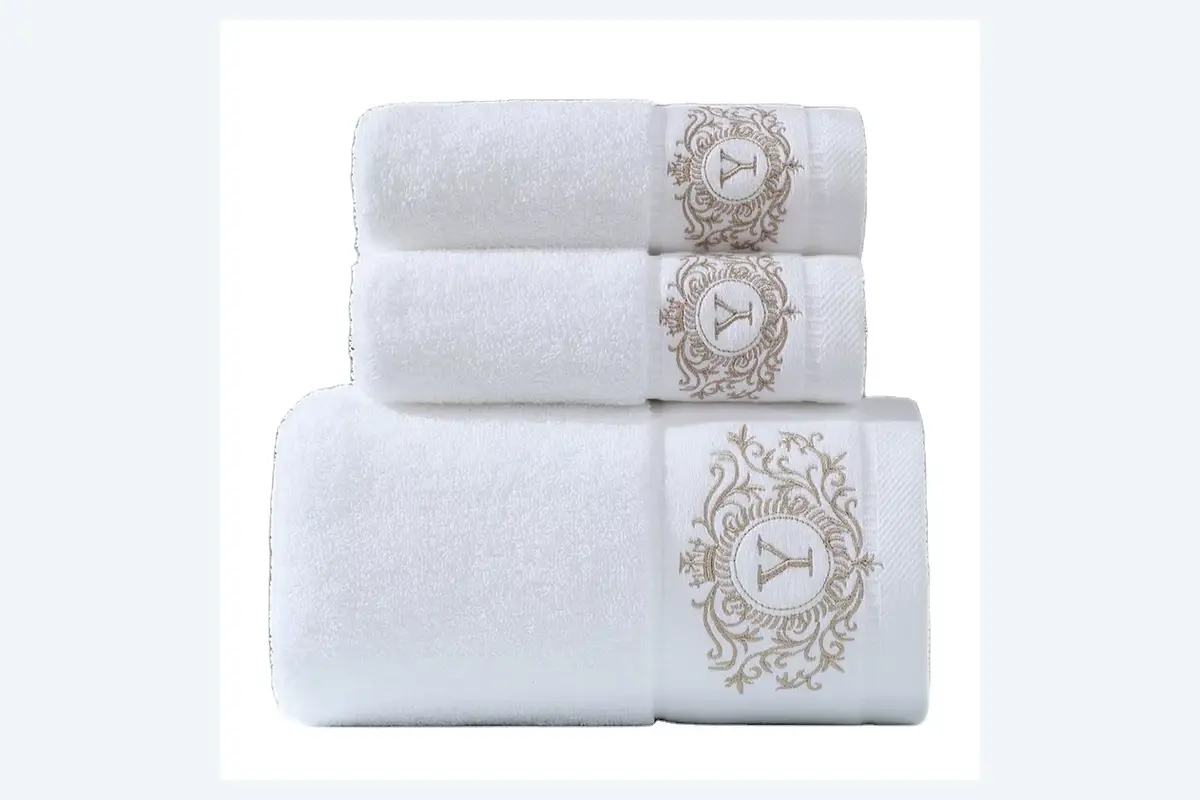 White embroidered hotel bath, hand, and face towel set for guest rooms