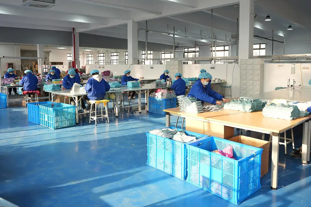 Production team organizing custom towels during finishing and inspection