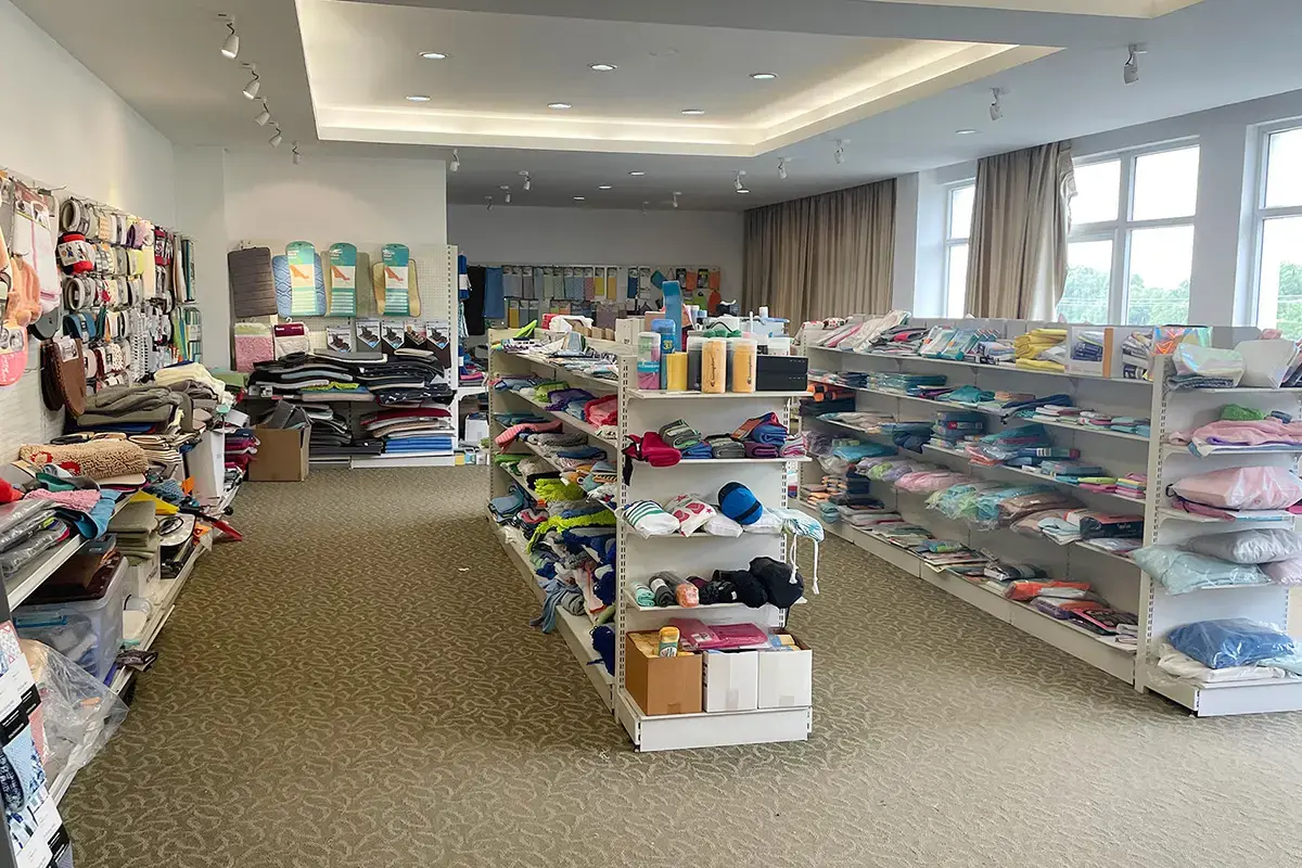 Finished towel and textile samples organized in a development showroom