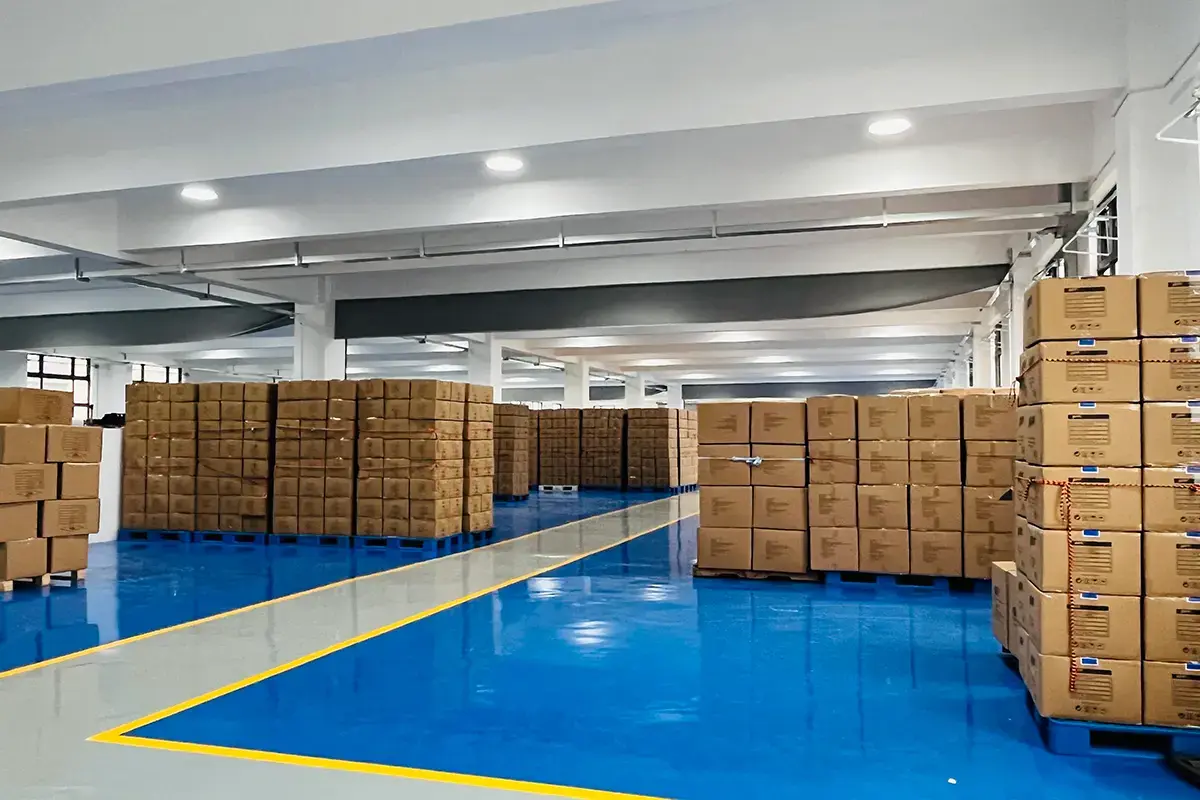 Labeled cartons staged in an organized warehouse for order traceability review